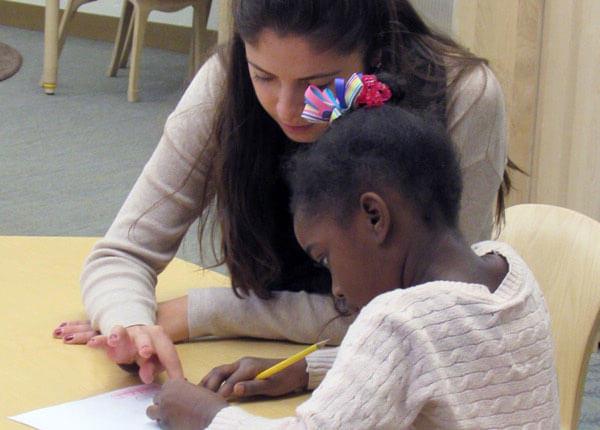 Teacher with elementary student